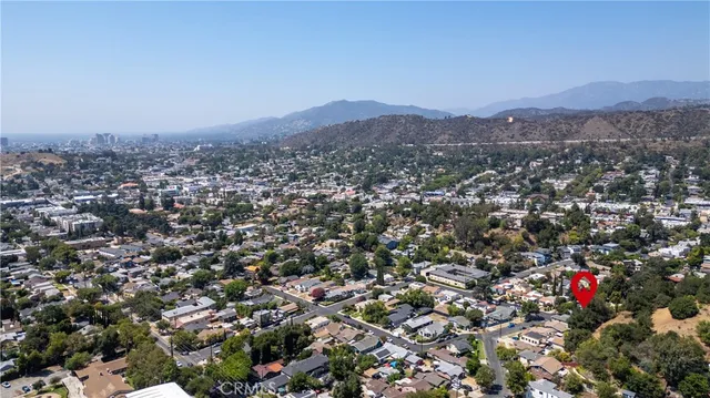 an aerial view of residential house and green space