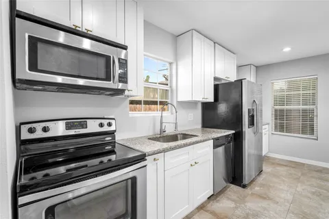 a large kitchen with cabinets