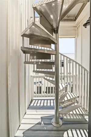 a view of staircase with white walls
