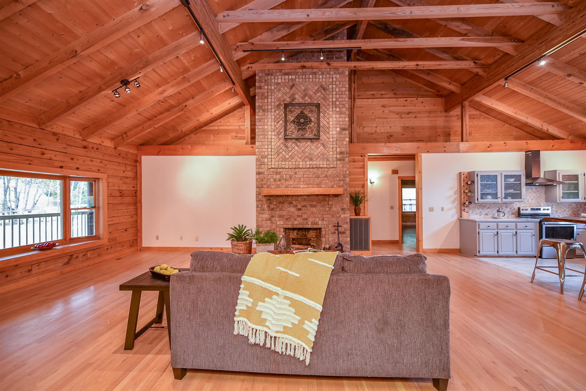 1615 Shell Road Goodlettsville, TN 37072 - Photo 9 of 30 a living room with furniture a wooden floor and a fireplace