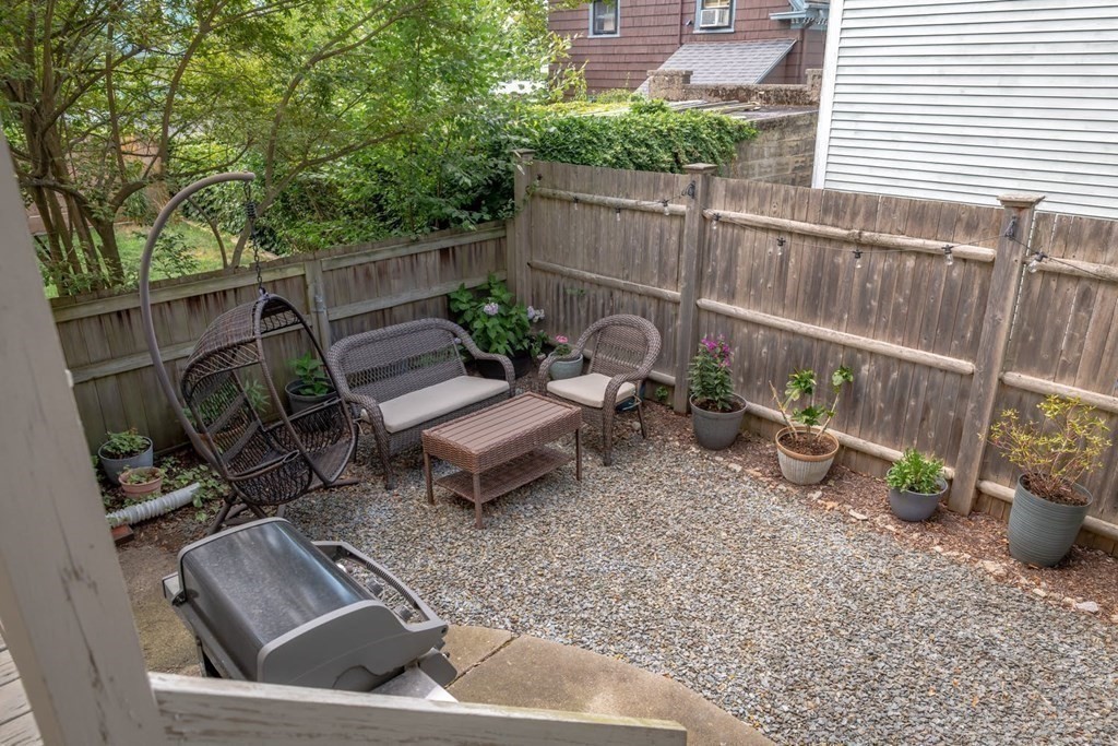 a view of a backyard with sitting area