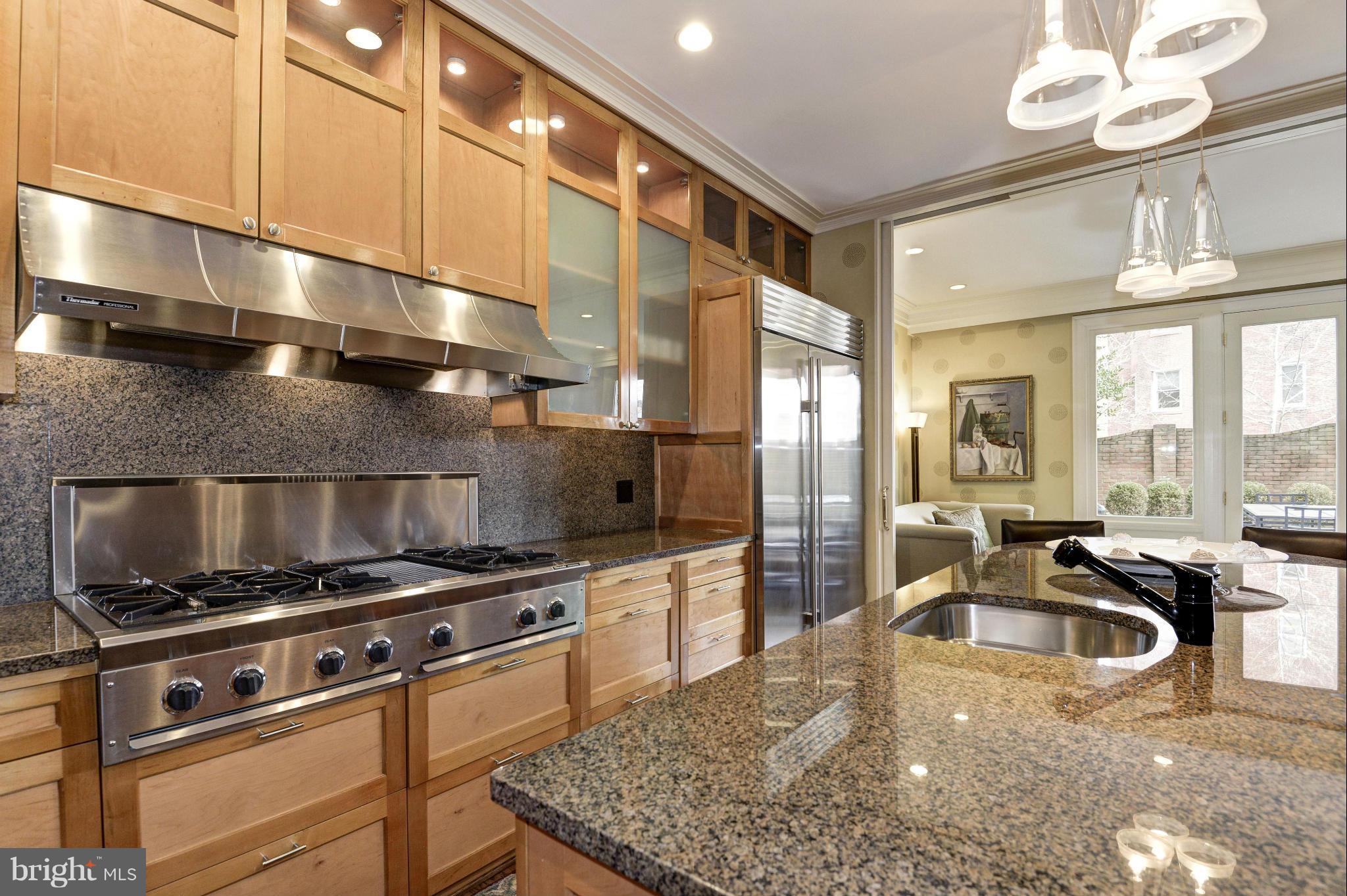1809 Kalorama Square Washington, DC 20008 - Photo 5 of 27 a kitchen with stainless steel appliances granite countertop a sink a stove and a refrigerator