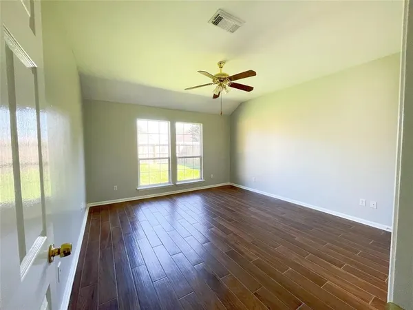 a bathroom with a bathtub and a toilet
