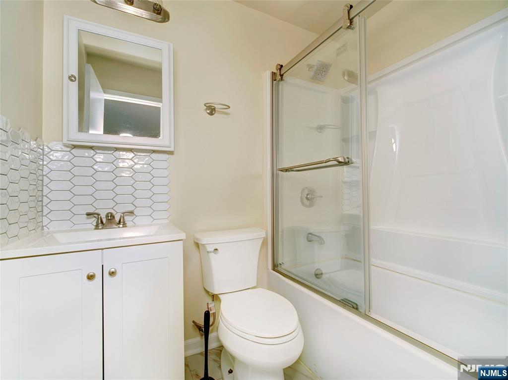 850 Bloomfield Avenue, Unit A3 Montclair, NJ 07042 - Photo 14 of 14 a bathroom with a sink a toilet and shower