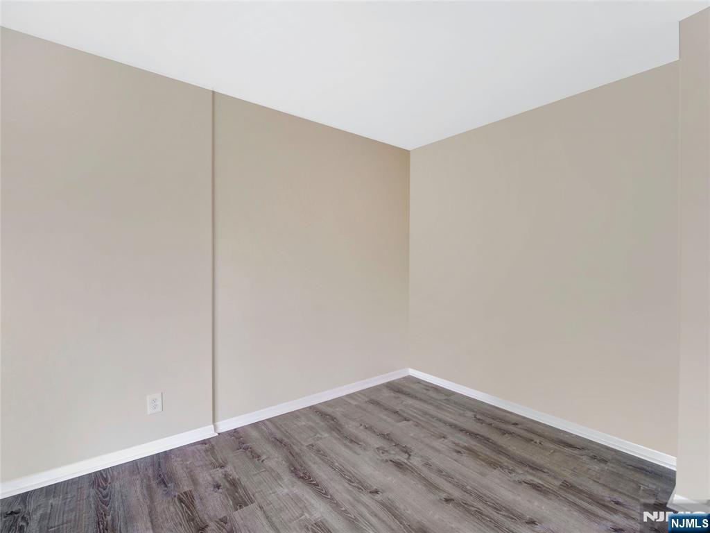 850 Bloomfield Avenue, Unit A3 Montclair, NJ 07042 - Photo 9 of 14 a view of an empty room with wooden floor