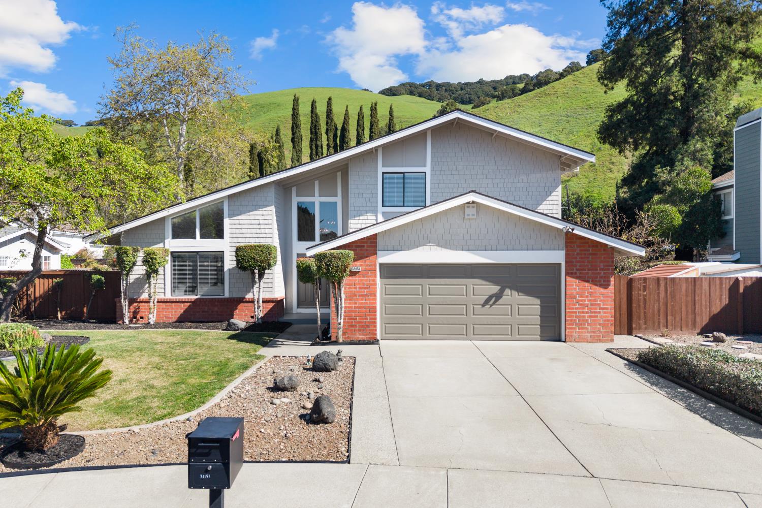 38651 Chrisholm Place Fremont, CA 94536 - Photo 1 of 1 a house view with a garden space