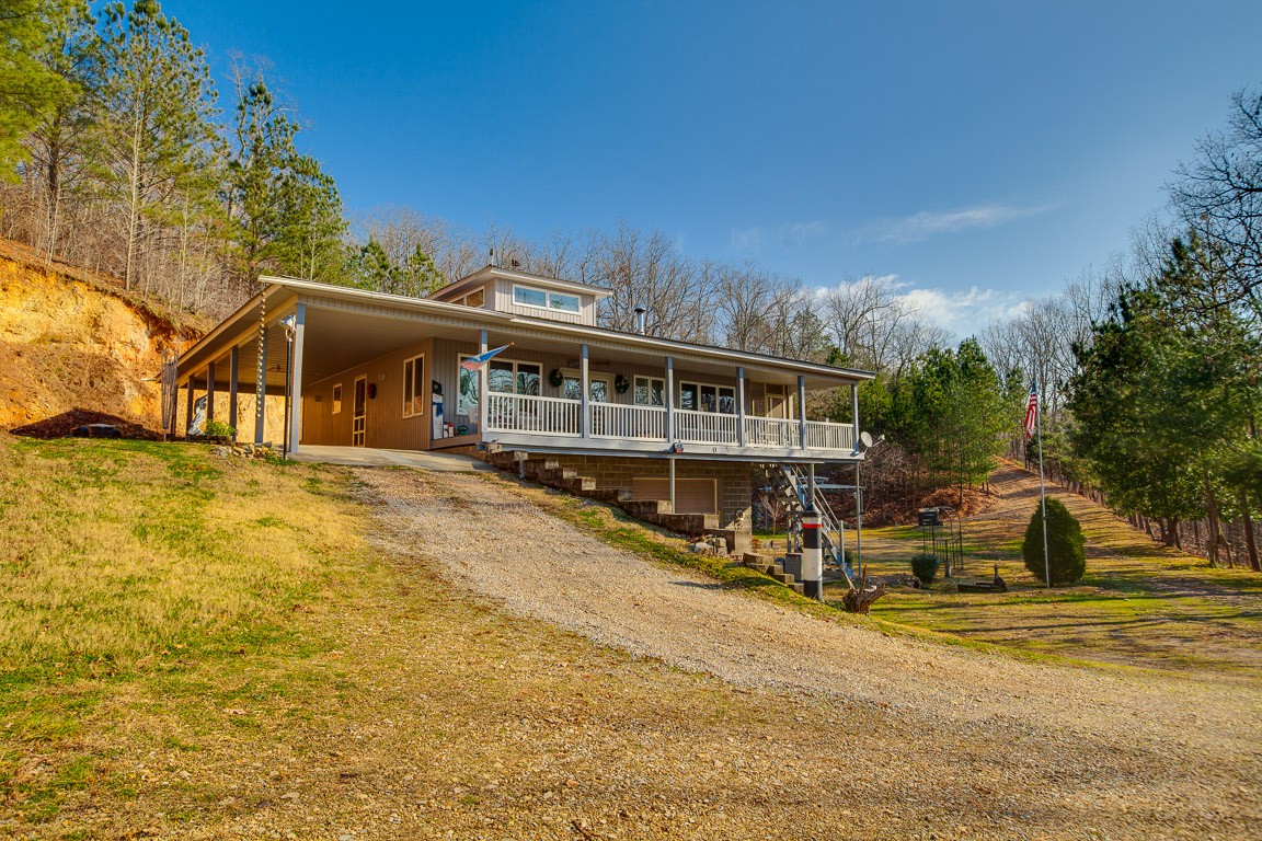 3155 Rocky Point Road Stewart, TN 37175 - Photo 2 of 44 a view of house with outdoor space and swimming pool