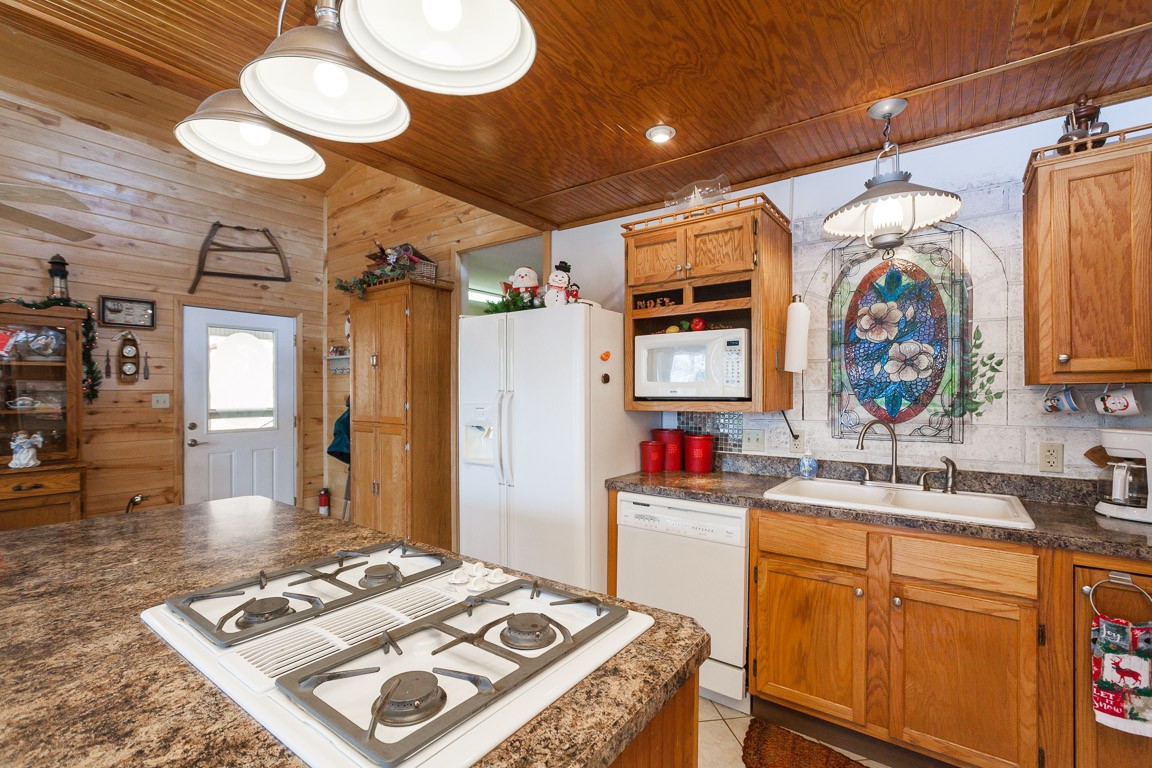 3155 Rocky Point Road Stewart, TN 37175 - Photo 12 of 44 a kitchen that has a sink and a stove in it