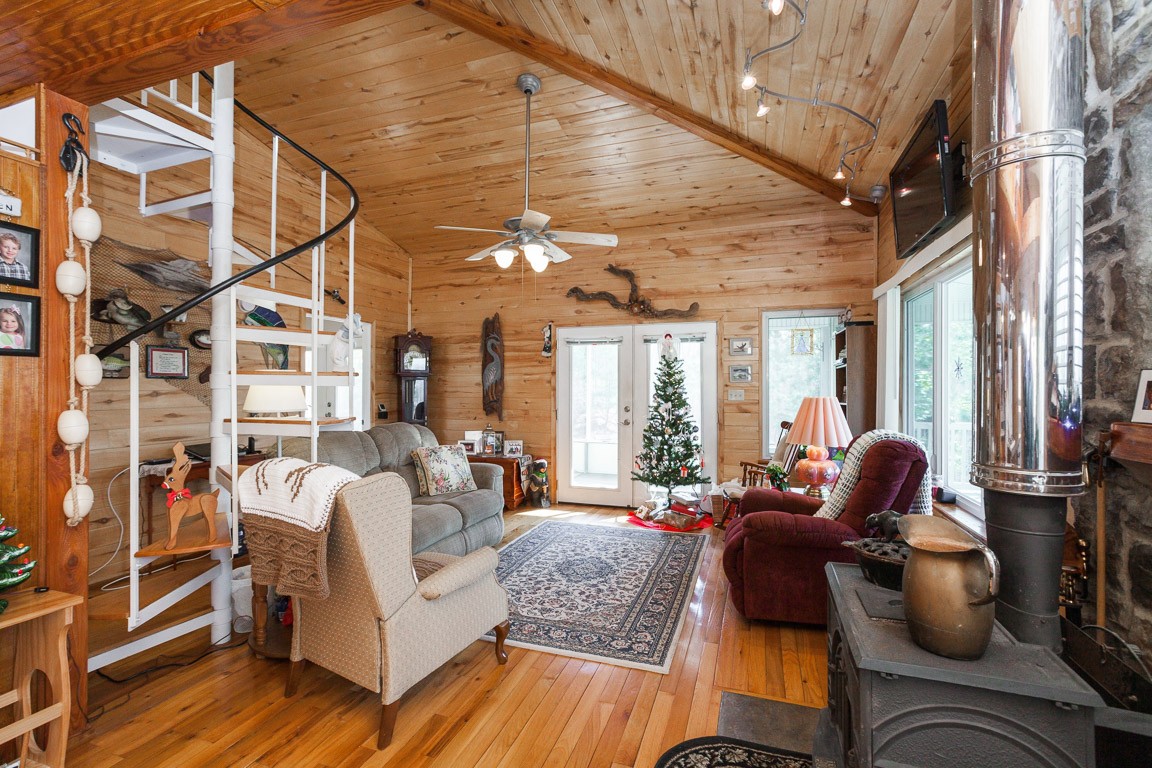 3155 Rocky Point Road Stewart, TN 37175 - Photo 14 of 44 a living room with furniture and wooden floor