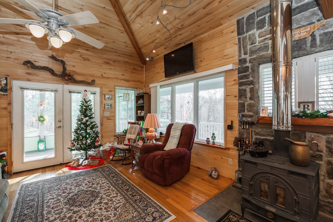 3155 Rocky Point Road Stewart, TN 37175 - Photo 15 of 44 a living room with furniture fireplace and large windows