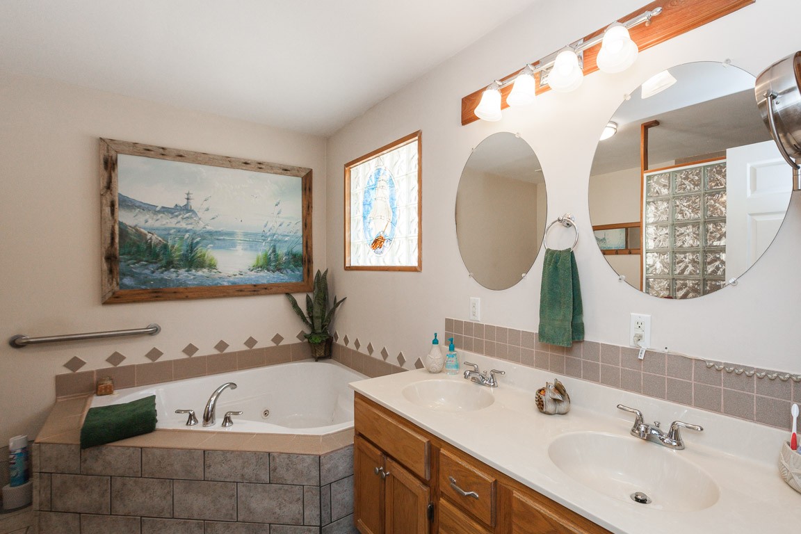 3155 Rocky Point Road Stewart, TN 37175 - Photo 20 of 44 a bathroom with a sink and a mirror