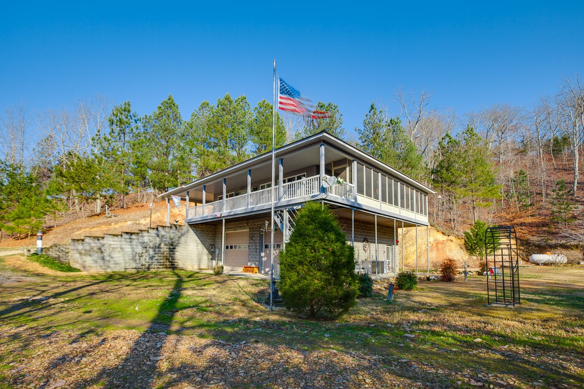 3155 Rocky Point Road Stewart, TN 37175 - Photo 3 of 44 a front view of a house with a yard