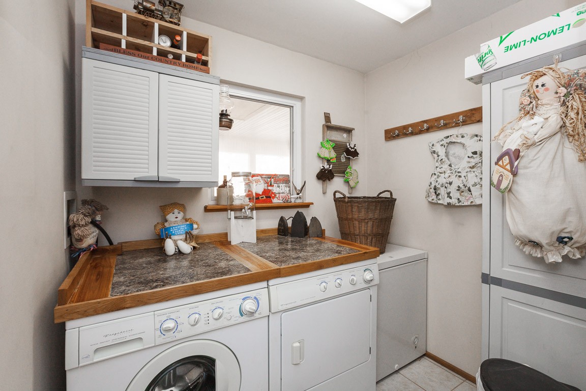 3155 Rocky Point Road Stewart, TN 37175 - Photo 27 of 44 a kitchen with stainless steel appliances granite countertop a sink and a stove next to a window