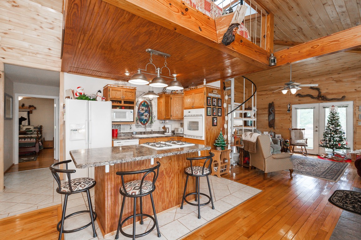 3155 Rocky Point Road Stewart, TN 37175 - Photo 8 of 44 a dining room with furniture and wooden floor
