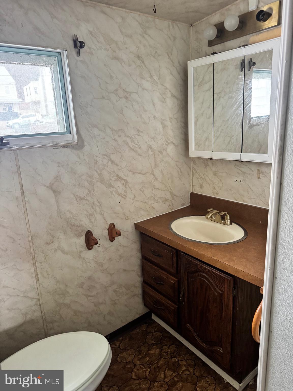 1620 Walnut Street Ashland, PA 17921 - Photo 15 of 25 a bathroom with a sink a toilet and mirror