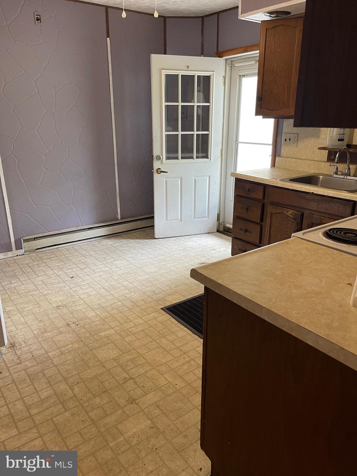 1620 Walnut Street Ashland, PA 17921 - Photo 3 of 25 a kitchen with kitchen island a sink a stove and a window
