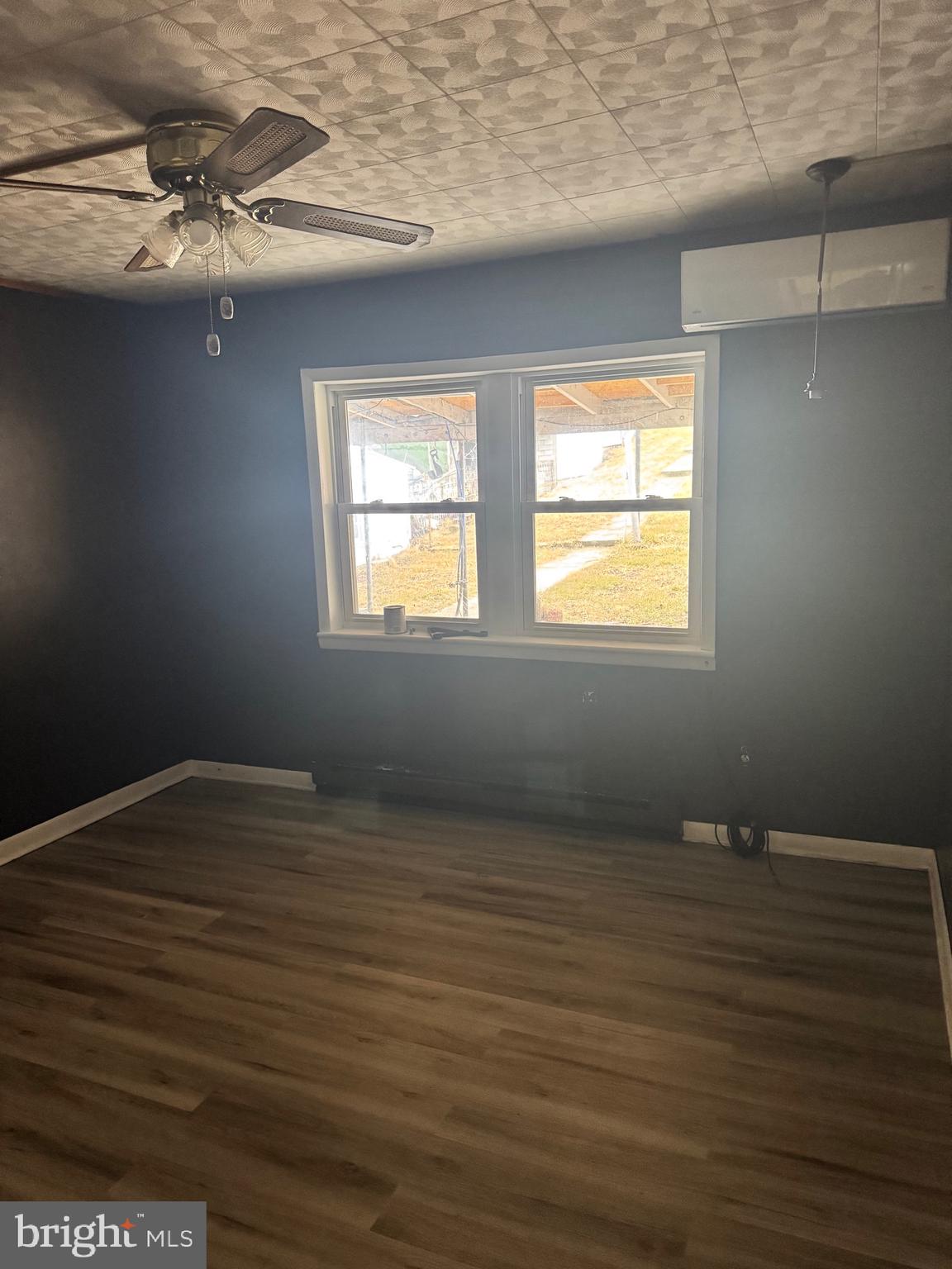 1620 Walnut Street Ashland, PA 17921 - Photo 8 of 25 a view of an empty room with wooden floor and a window