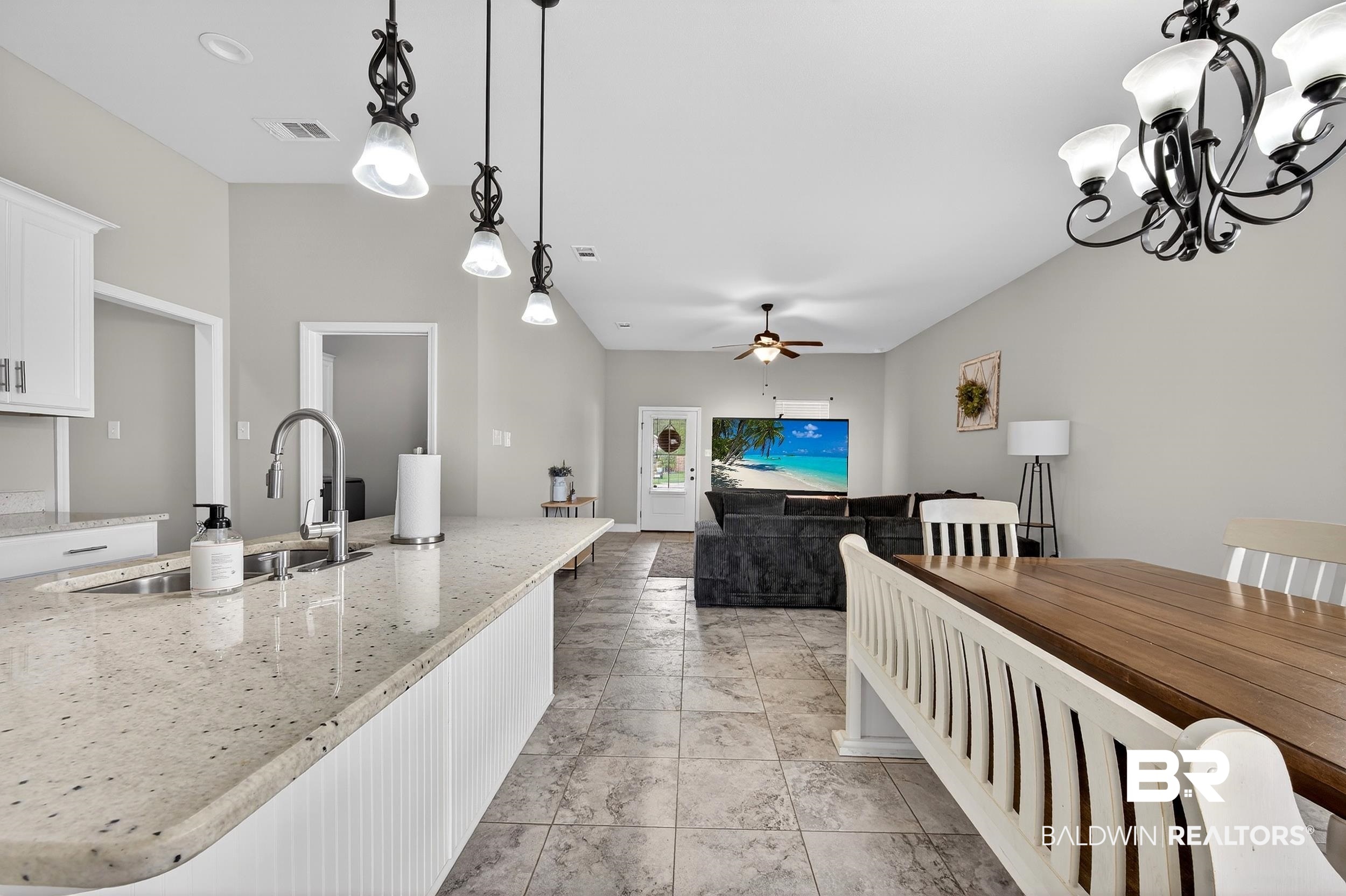 1084 Stella Road Foley, AL 36535 - Photo 31 of 31 Kitchen featuring white cabinets, light stone countertops, ceiling fan, open floor plan, and pendant lighting