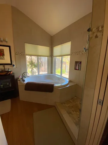 a view of a hallway and a livingroom with furniture