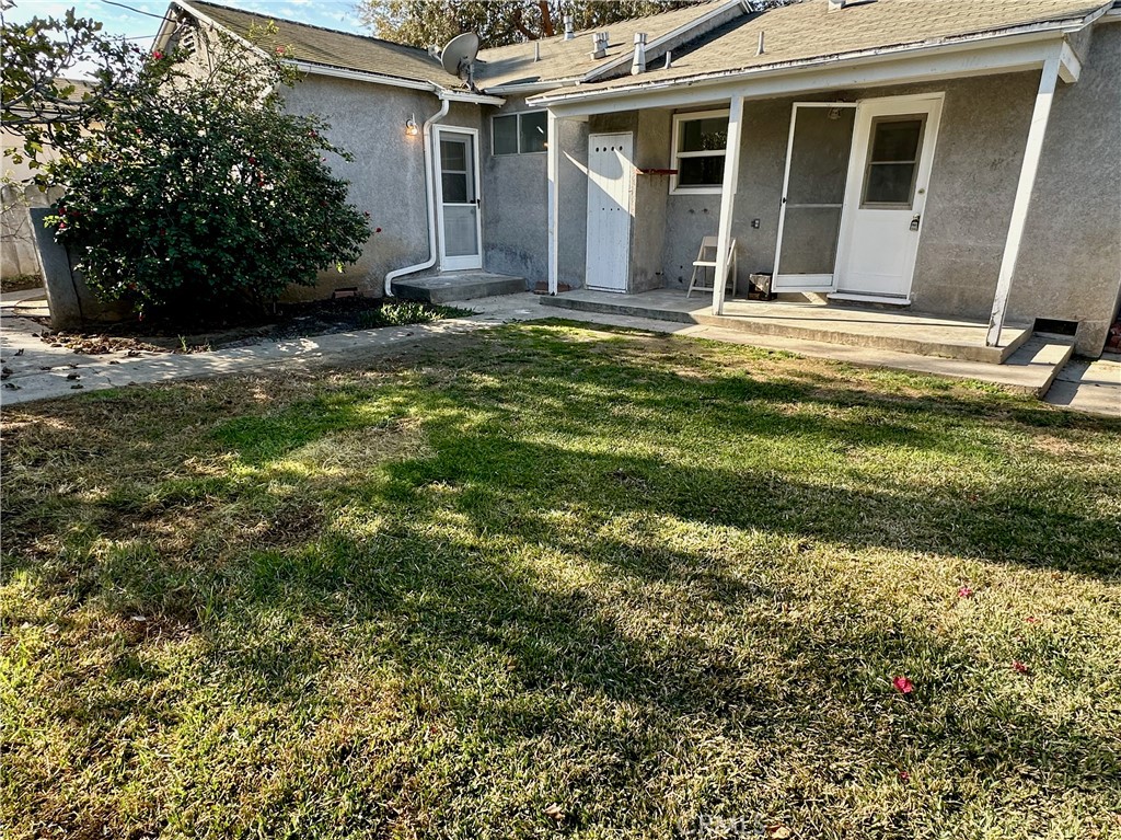 291 North Main Street Orange, CA 92868 - Photo 17 of 20 a view of a house with a yard
