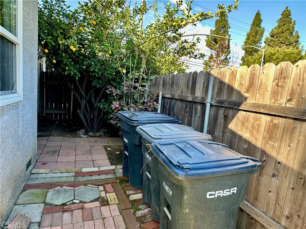 291 North Main Street Orange, CA 92868 - Photo 18 of 20 a wooden bench sitting in front of a building