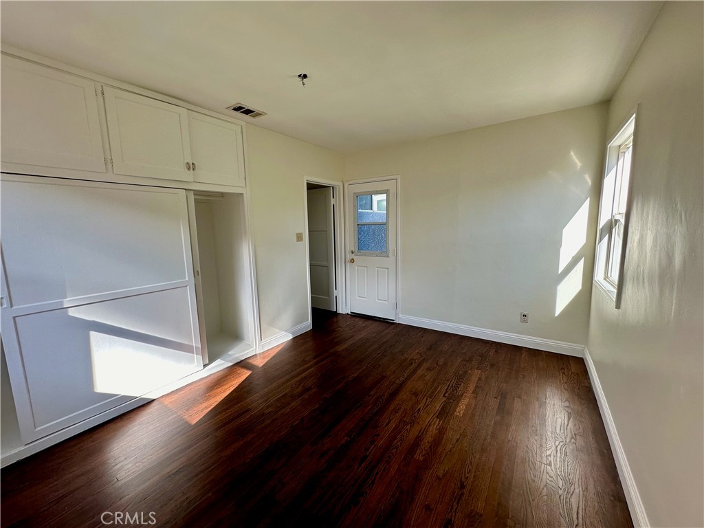 291 North Main Street Orange, CA 92868 - Photo 9 of 20 a view of hallway with wooden floor