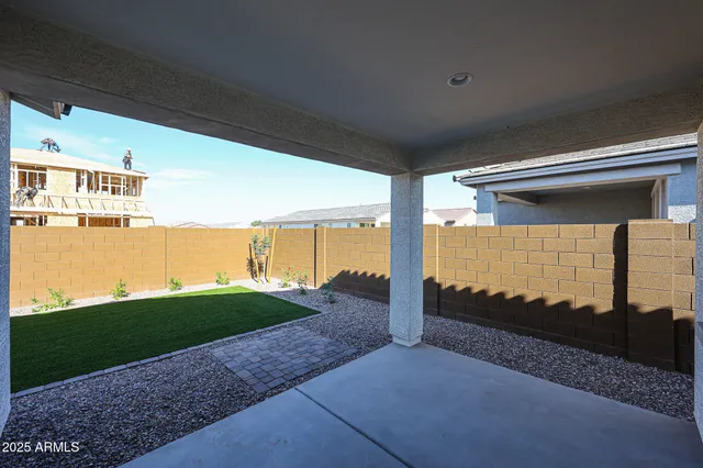 a view of a room with floor to ceiling windows with yard