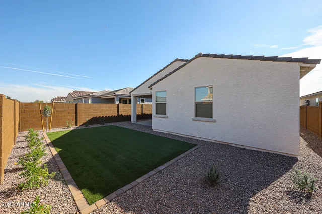 a view of a backyard of the house