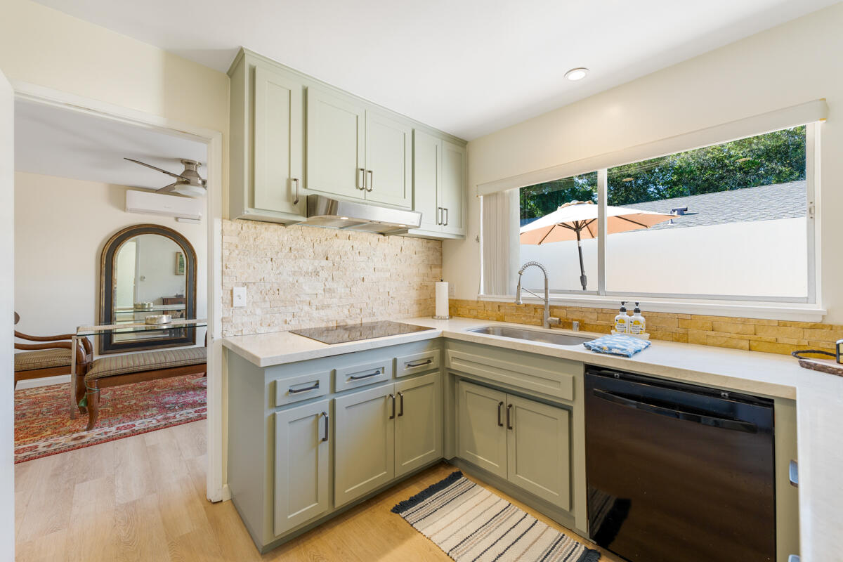 4126 Foothill Road Santa Barbara, CA 93110 - Photo 12 of 32 a kitchen with a sink stove and cabinets