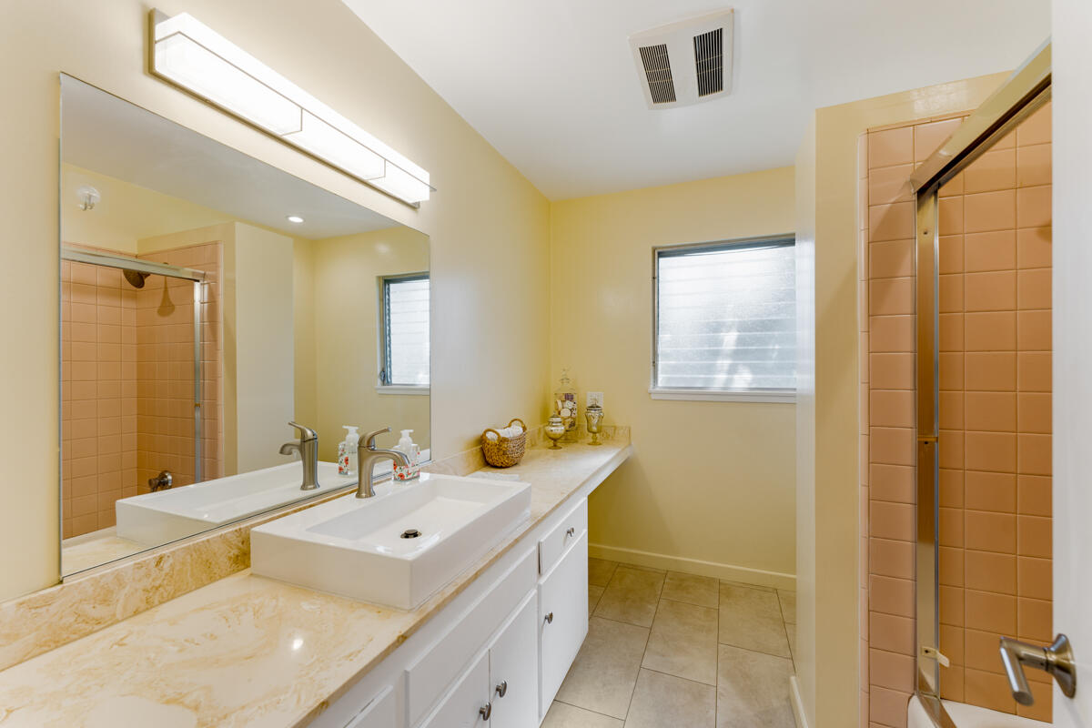 4126 Foothill Road Santa Barbara, CA 93110 - Photo 18 of 32 a bathroom with a tub sink and mirror