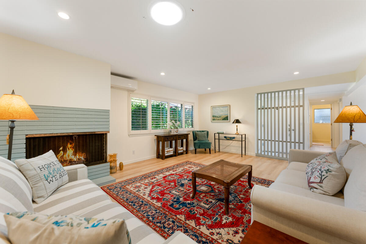 4126 Foothill Road Santa Barbara, CA 93110 - Photo 6 of 32 a living room with furniture large window and a fireplace