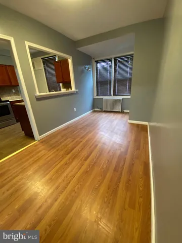 a kitchen with kitchen island a sink stainless steel appliances and a refrigerator
