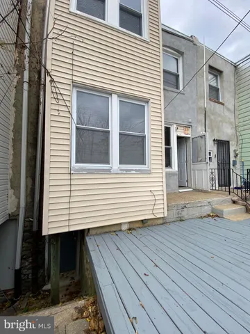 a view of a livingroom with furniture and a window