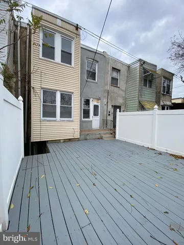 a view of an empty room with glass door