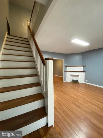 a view of livingroom with furniture wooden floor and windows