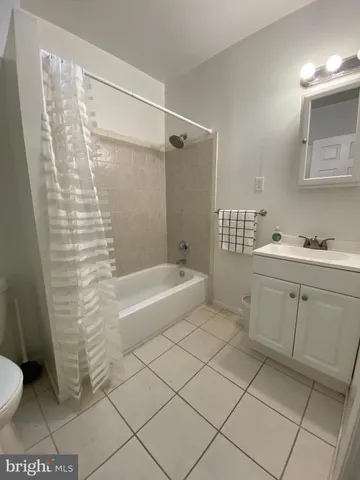 an empty room with windows and furniture