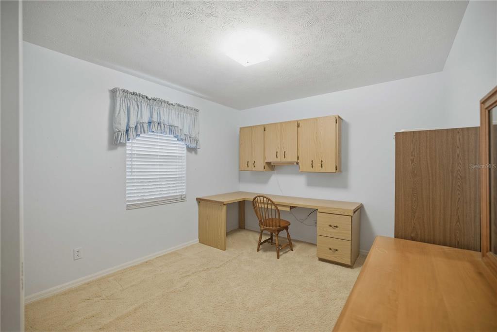 3654 Southeast 68th Street Ocala, FL 34480 - Photo 15 of 25 a workspace with a couch and a window