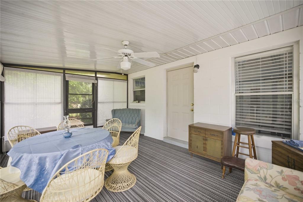 3654 Southeast 68th Street Ocala, FL 34480 - Photo 17 of 25 a view of a dining room with furniture window and wooden floor
