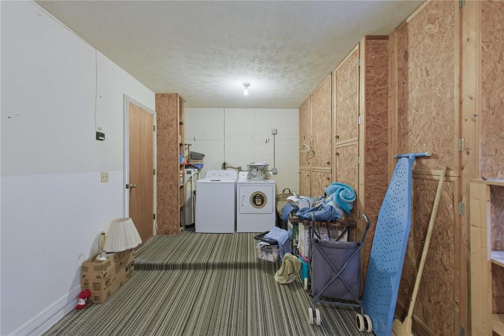 3654 Southeast 68th Street Ocala, FL 34480 - Photo 19 of 25 a bed room with furniture and wooden floor