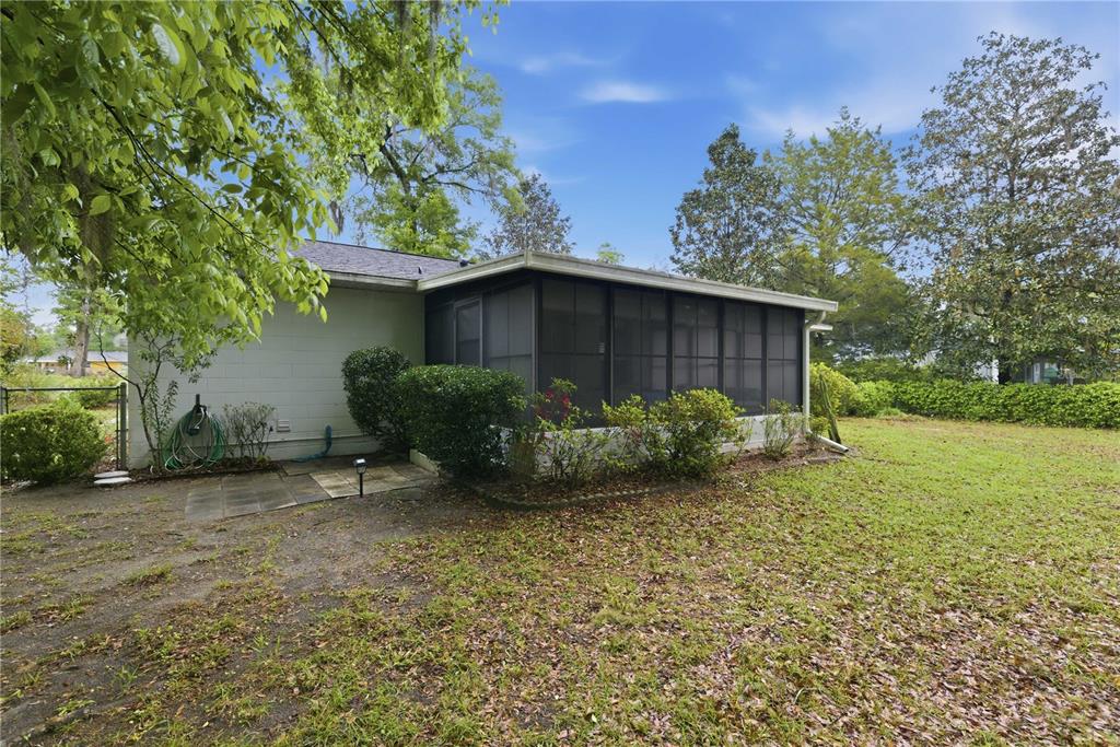 3654 Southeast 68th Street Ocala, FL 34480 - Photo 21 of 25 a view of a house with backyard and garden