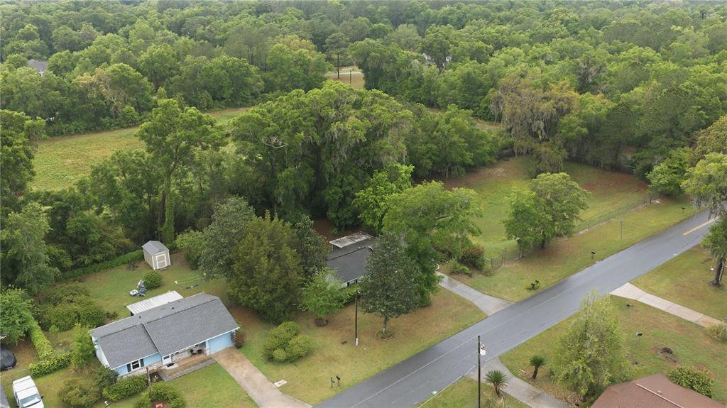 3654 Southeast 68th Street Ocala, FL 34480 - Photo 23 of 25 an aerial view of a house with a yard