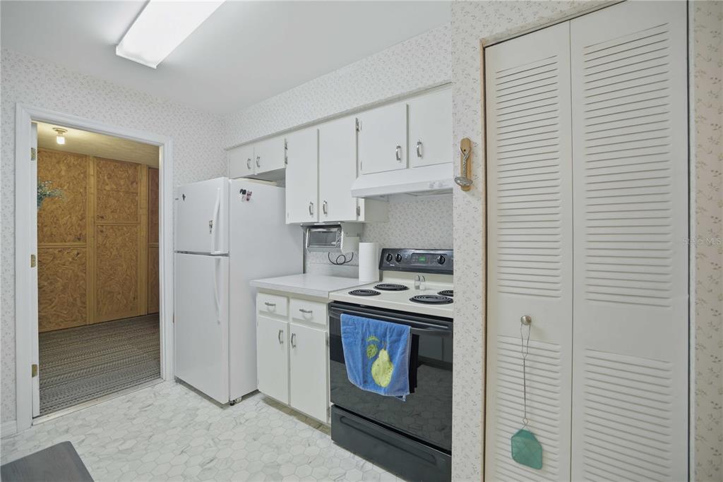 3654 Southeast 68th Street Ocala, FL 34480 - Photo 8 of 25 a kitchen with cabinets and a stove top oven