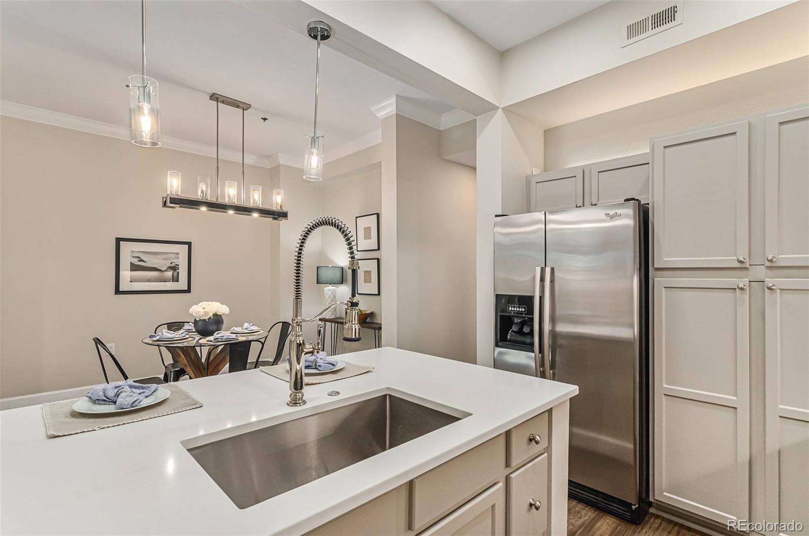 2580 17th Street, Unit 202 Denver, CO 80211 - Photo 11 of 32 a kitchen with refrigerator sink and cabinets