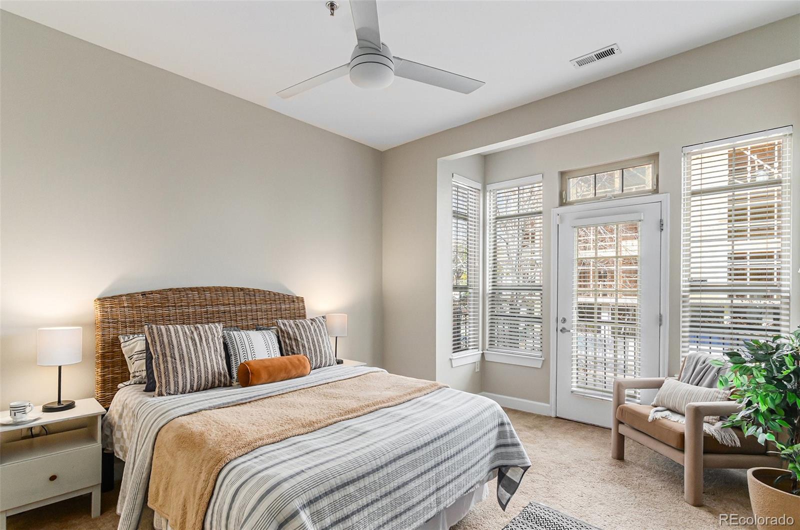 2580 17th Street, Unit 202 Denver, CO 80211 - Photo 15 of 32 a bedroom with a large bed and windows