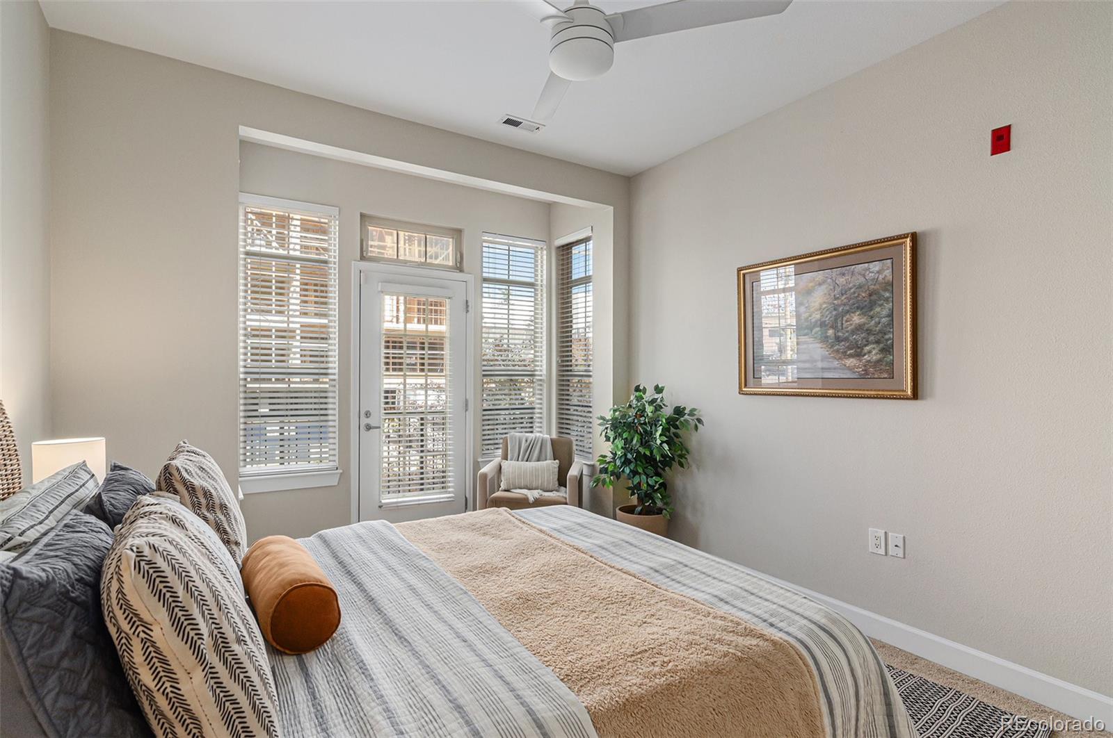 2580 17th Street, Unit 202 Denver, CO 80211 - Photo 16 of 32 a bedroom with bed and a large window