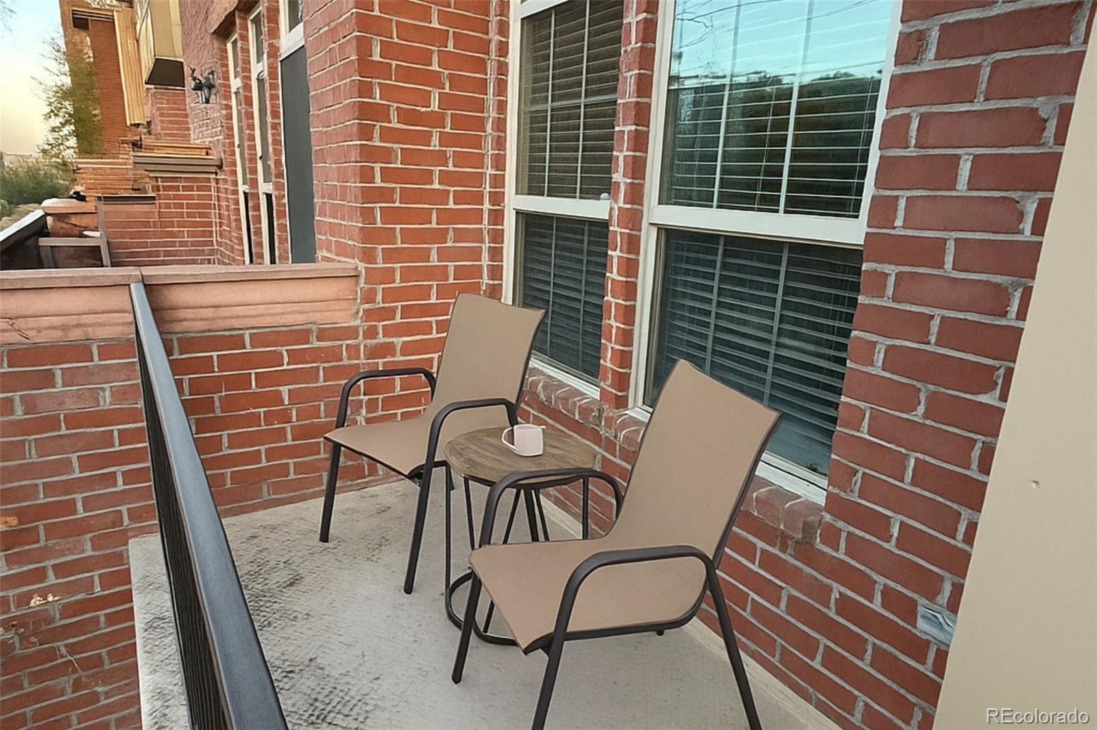 2580 17th Street, Unit 202 Denver, CO 80211 - Photo 17 of 32 a view of a chair and table in the balcony