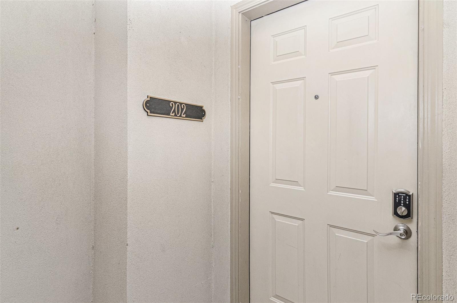 2580 17th Street, Unit 202 Denver, CO 80211 - Photo 23 of 32 a bathroom with a shower and a mirror