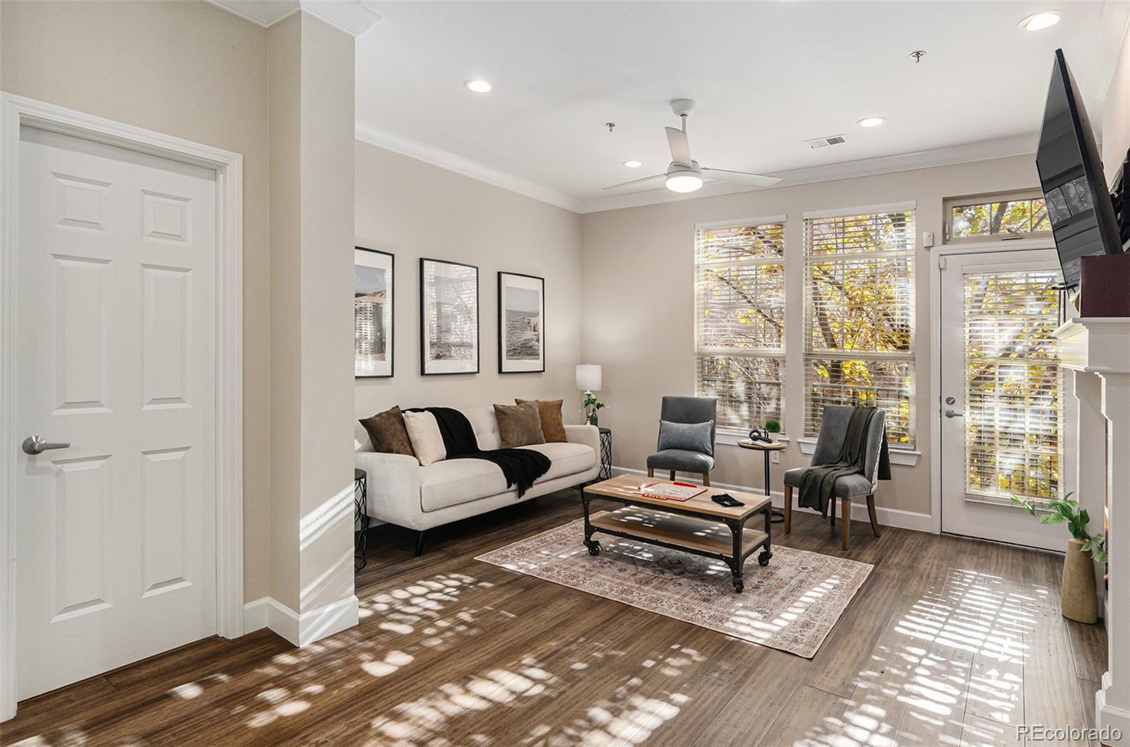 2580 17th Street, Unit 202 Denver, CO 80211 - Photo 4 of 32 a living room with furniture and a chandelier
