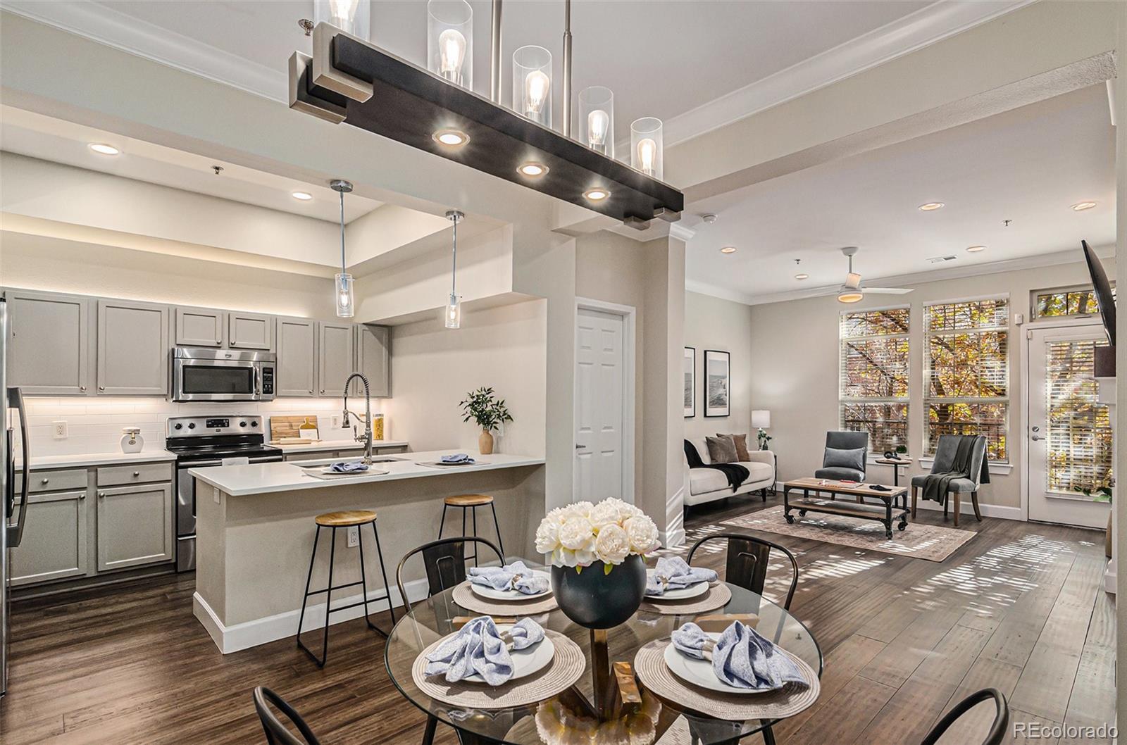 2580 17th Street, Unit 202 Denver, CO 80211 - Photo 8 of 32 a kitchen with a table and chairs in it