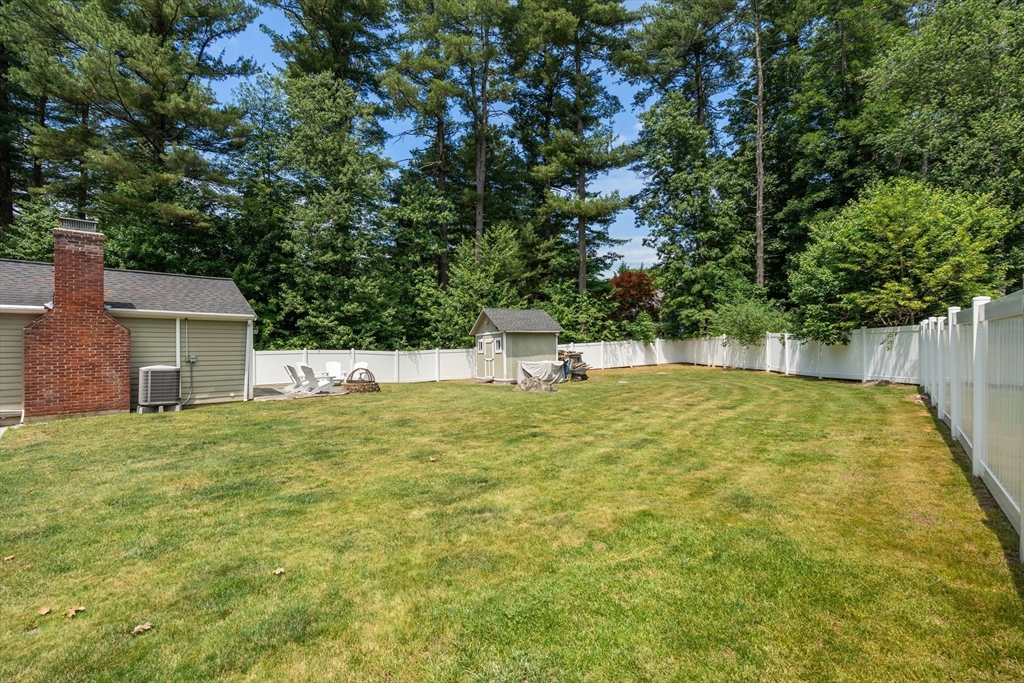 57 Marlboro Road Sudbury, MA 01776 - Photo 29 of 40 a view of back yard with swimming pool